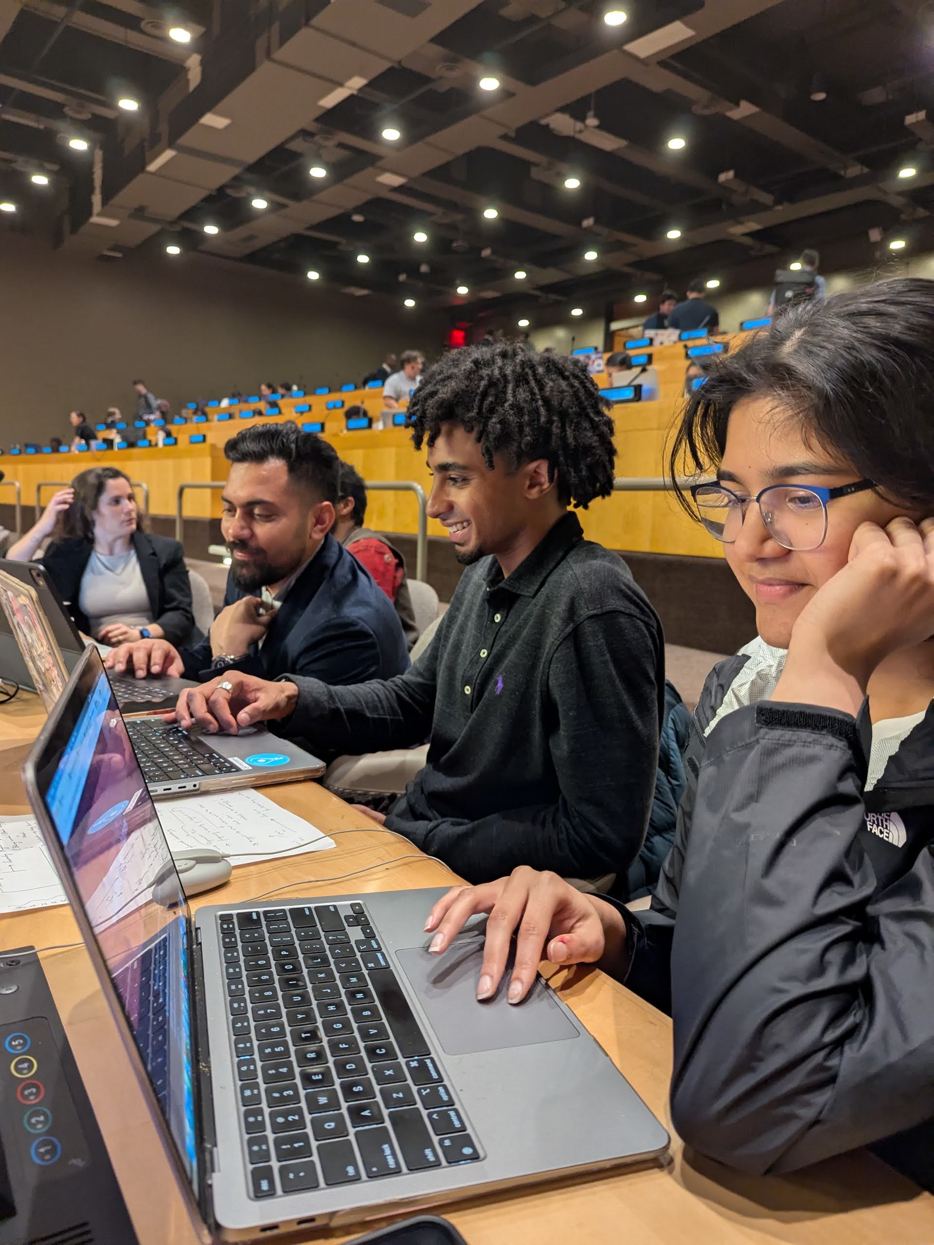 students with their laptops at the UN Hackathon