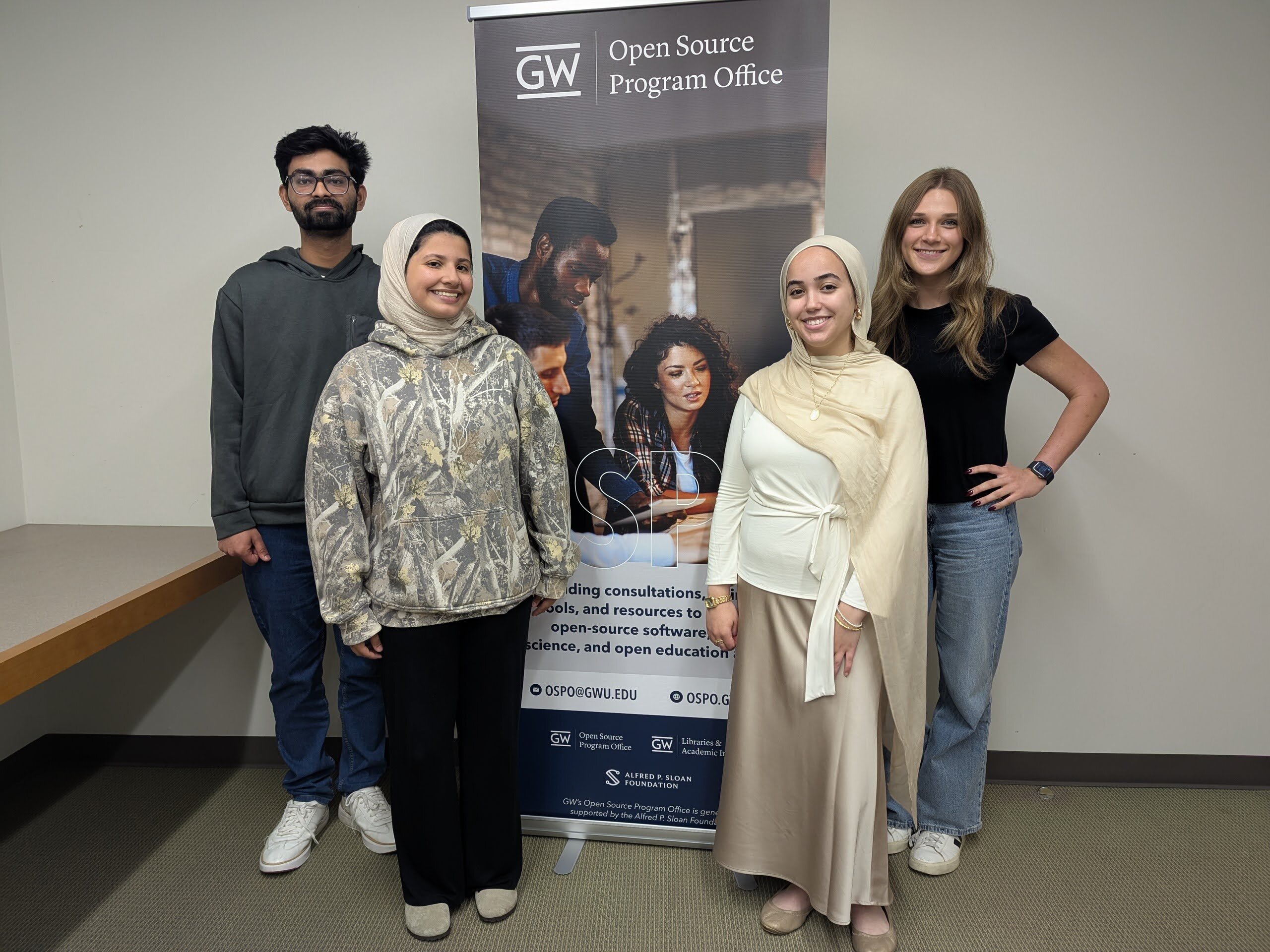 2025 OSPO student ambassadors pose with OSPO banner
