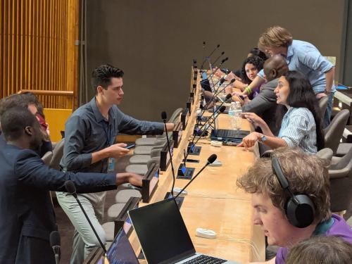 students and professionals working at the UN Hackathon