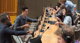 students and professionals working at the UN Hackathon