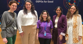 GW students standing in front of an OSPOs for Good sign at the UN Hackathon